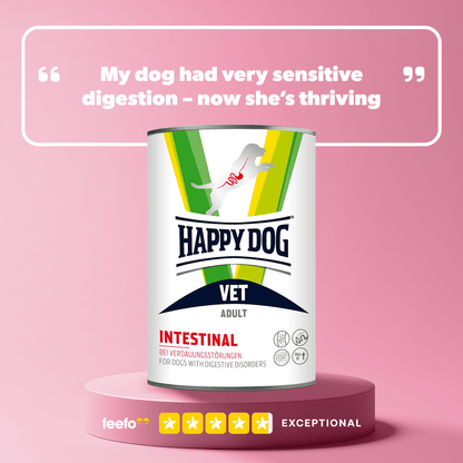 Happy Dog Vet Intestinal can on a pink background with a quote about a dog's improved health.